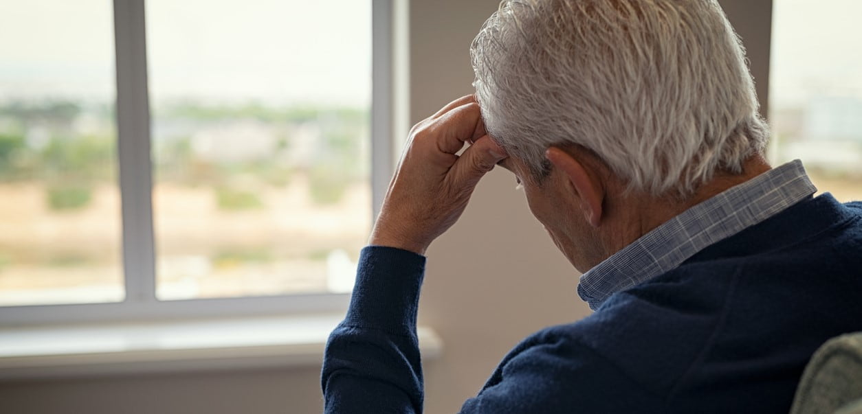 Man with high functioning alcoholism looking out window