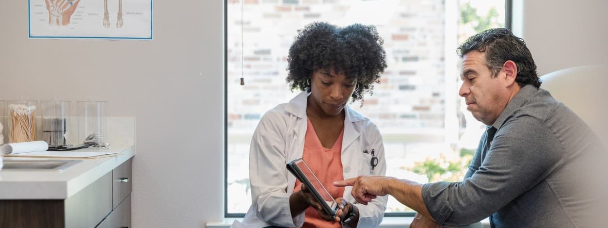 Man speaking with doctor about how to detox from drugs safely