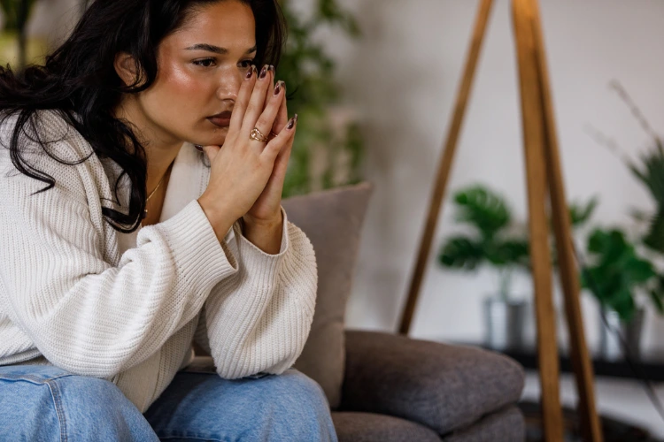 Is addiction a form of ocd? An image of a woman contemplating while struggling with negative emotions.